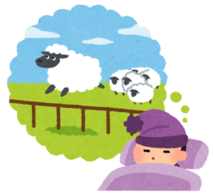 羊を数えながら寝ようとする人